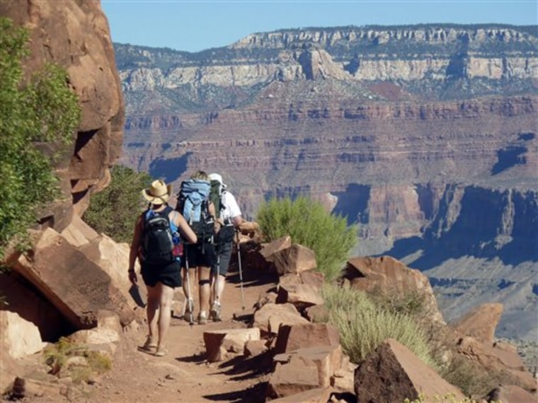 Hikers walk along the South Kaibab Trail on Sept. 27 in Arizona's Grand Canyon National Park. For the well-prepared who are relatively physically fit, hiking into the canyon is safe and offers an experience that's difficult to duplicate. 